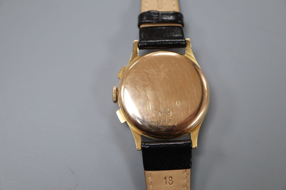 A gentlemans 1950s 18k Dulux chronograph manual wind wrist watch, on later associated strap.